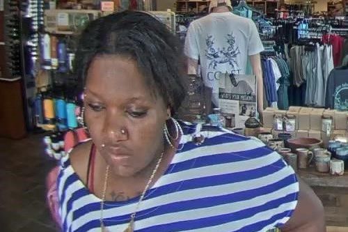 Police need help identifying this woman who was caught on camera stealing items from a business in Mobile. (Mobile Police)